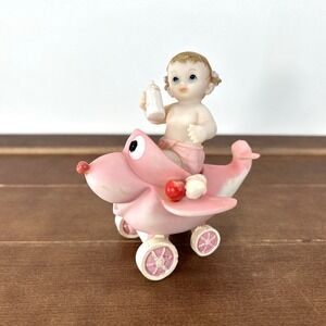 Vintage Resin Baby Girl Riding Pink‎ Airplane Figurine Holding Bottle 4" Tall